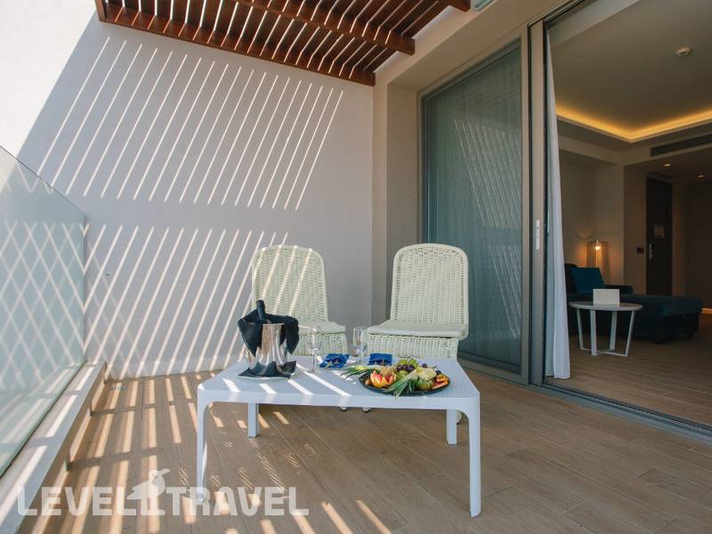 Фотография Almyros Beach Resort & Spa