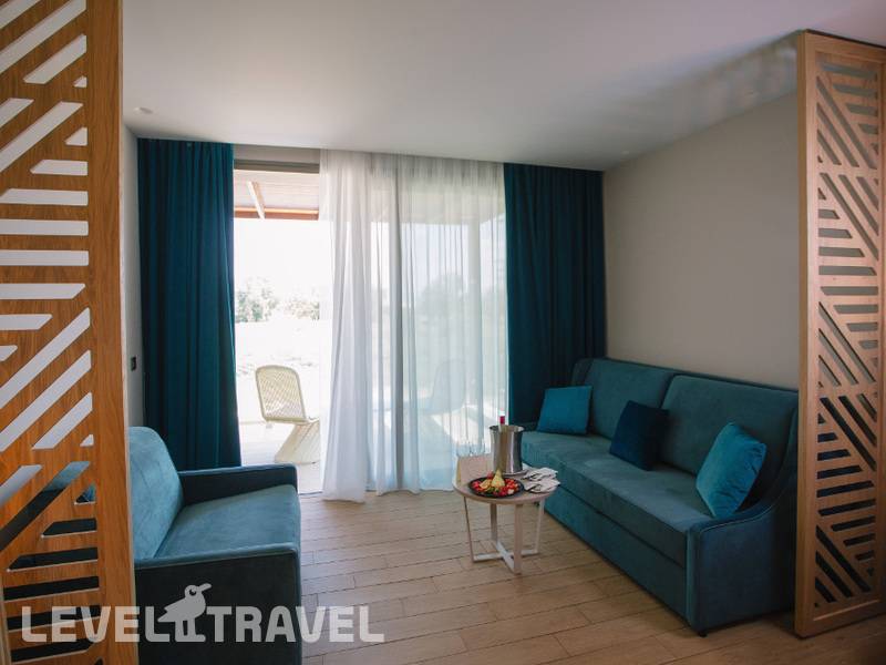 Фотография Almyros Beach Resort & Spa