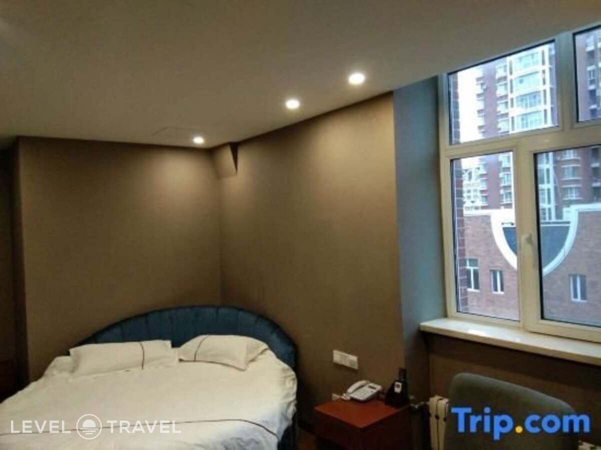 фотографии номера Делюкс с видом на город (две односпальные кровати) отеля Huaxi Hotel в Китай(Харбин) - фото №5