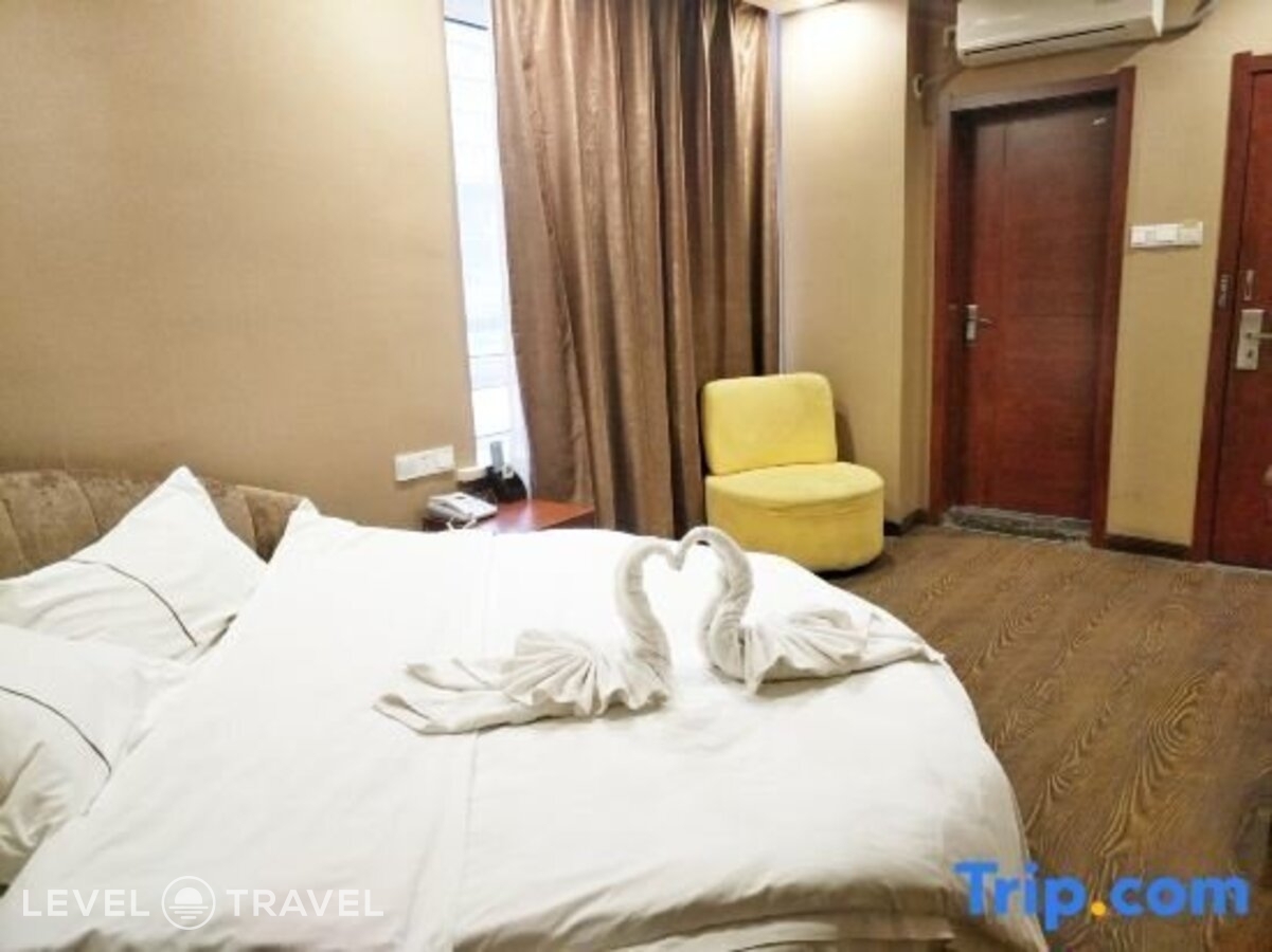фотографии номера Делюкс с видом на город (две односпальные кровати) отеля Huaxi Hotel в Китай(Харбин) - фото №1