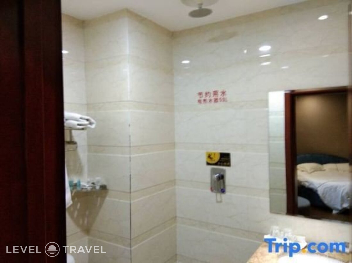 фотографии номера Делюкс с видом на город (две односпальные кровати) отеля Huaxi Hotel в Китай(Харбин) - фото №10