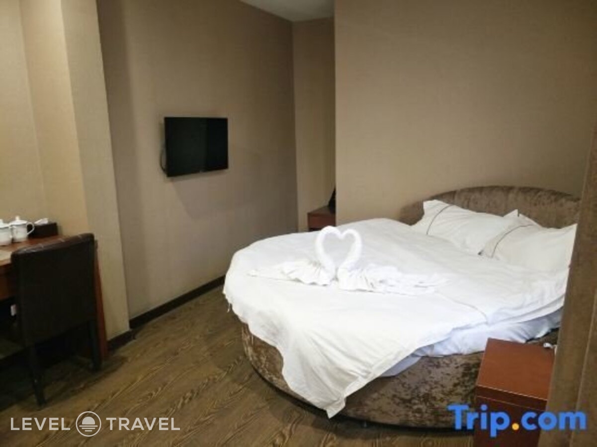 фотографии номера Делюкс с видом на город (две односпальные кровати) отеля Huaxi Hotel в Китай(Харбин) - фото №2