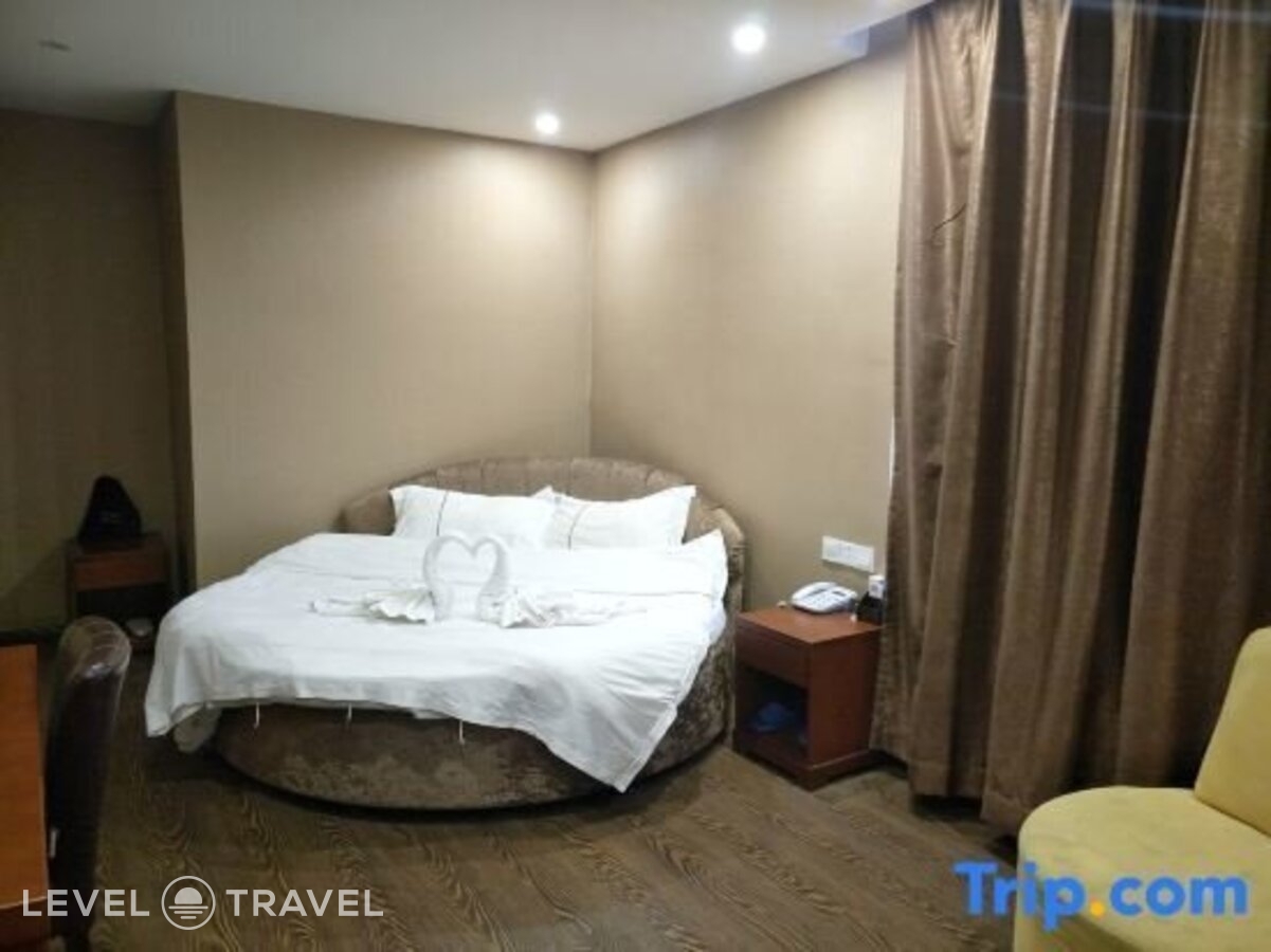 фотографии номера Делюкс с видом на город (две односпальные кровати) отеля Huaxi Hotel в Китай(Харбин) - фото №3