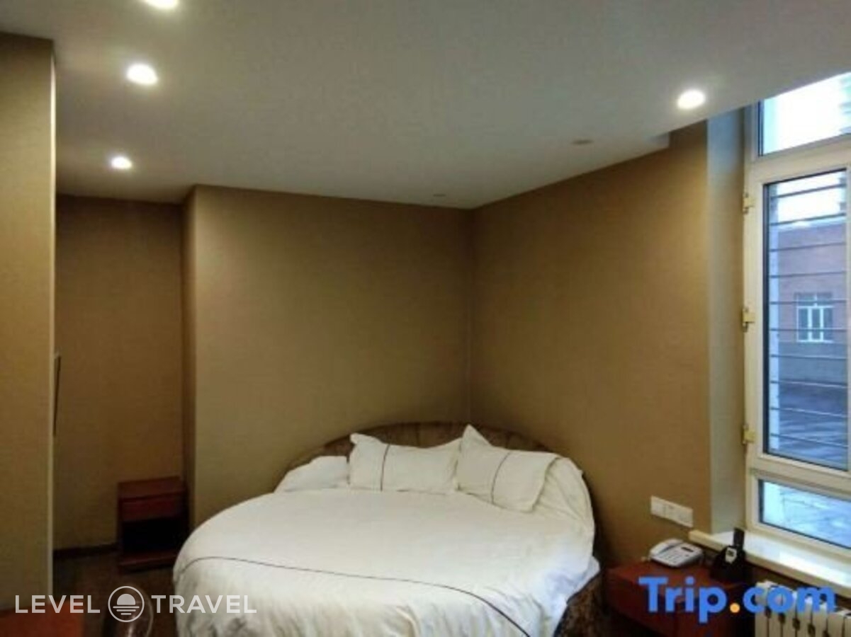 фотографии номера Делюкс с видом на город (две односпальные кровати) отеля Huaxi Hotel в Китай(Харбин) - фото №4