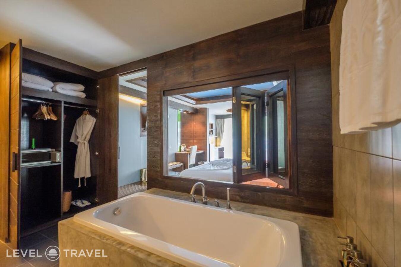 фотографии номера Гранд делюкс (две односпальные кровати) отеля Naina Resort & Spa в Таиланд(Патонг Бич) - фото №7