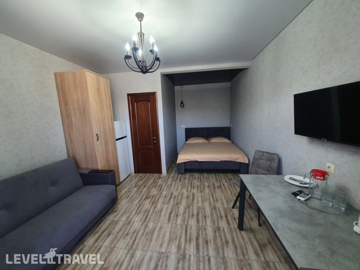 фотографии номера Четырёхместный номер Comfort с красивым видом из окна отеля Гостевой дом Аура в Россия(Избербаш) - фото №2