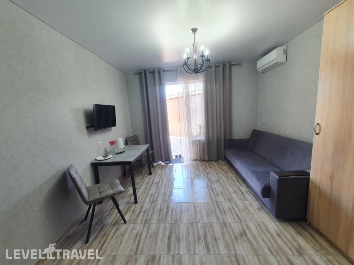 фотографии номера Четырёхместный номер Comfort с красивым видом из окна отеля Гостевой дом Аура в Россия(Избербаш) - фото №3
