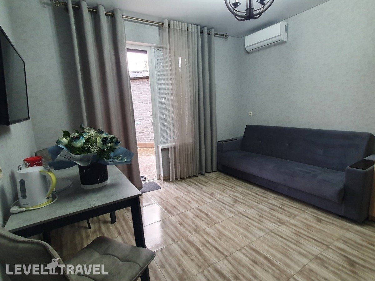фотографии номера Четырёхместный номер Comfort с красивым видом из окна отеля Гостевой дом Аура в Россия(Избербаш) - фото №10