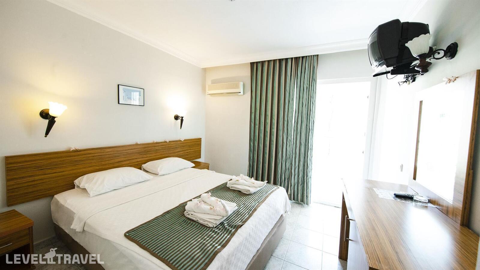 фотографии номера Экономичный без балкона отеля Mert Seaside Hotel (Adults Only 16+) (Ex. Cle Seaside Hotel, Ex. Armar Seaside) в Турция(Мармарис - центр) - фото №1