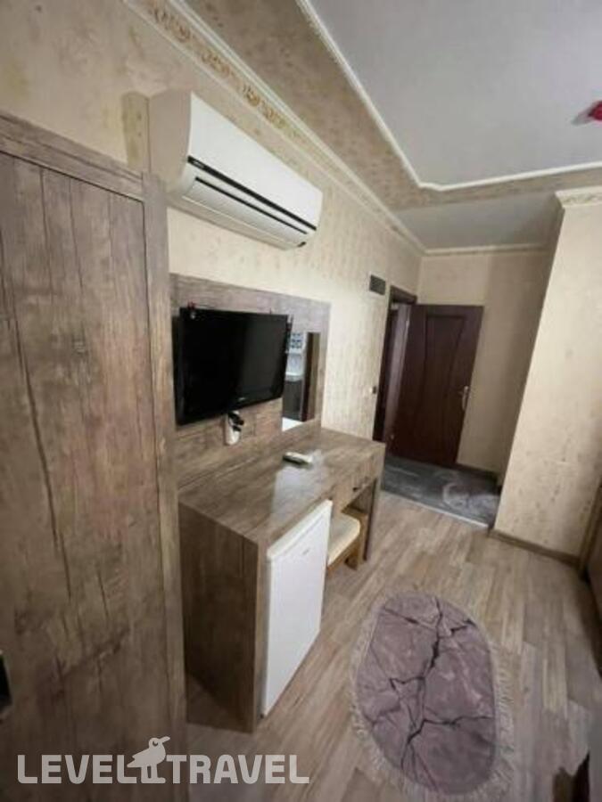 фотографии номера Трехместный номер отеля Ozgur Hotel в Турция(Анталья - Центр) - фото №6