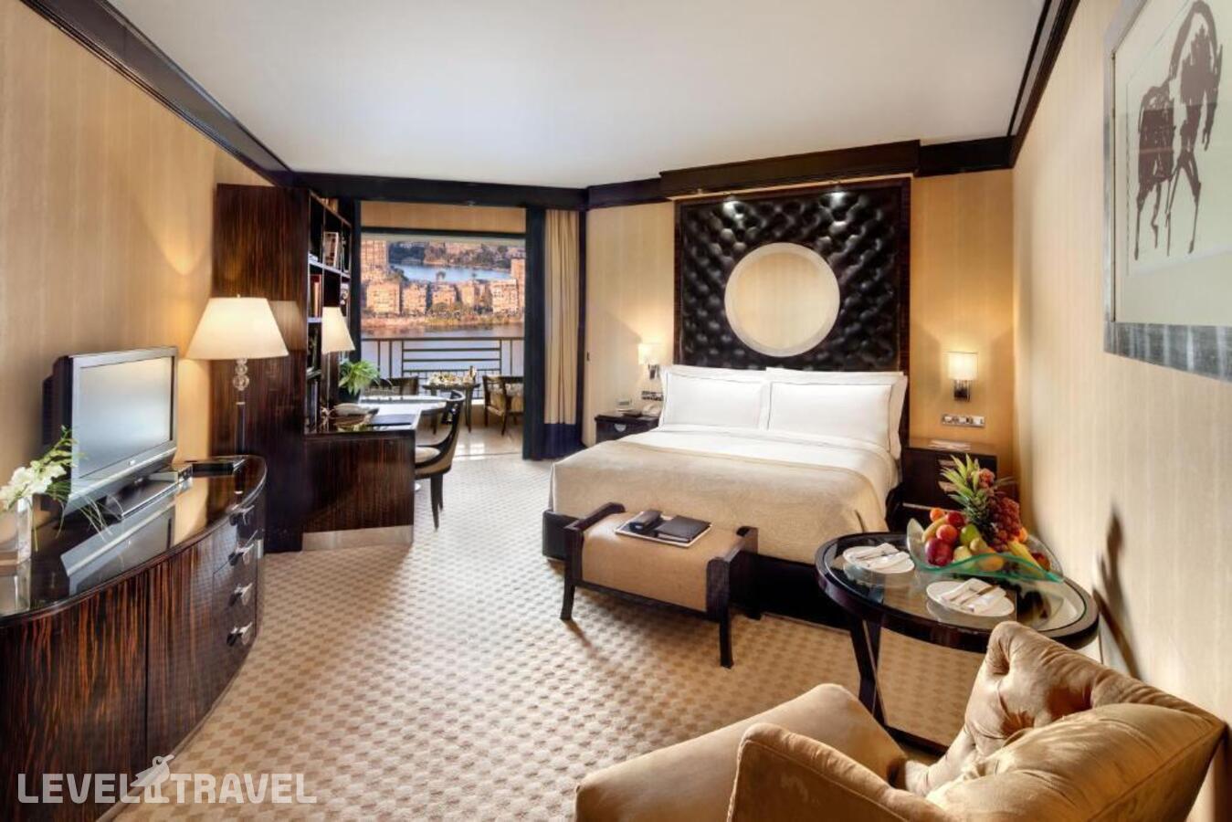 фотографии номера Двухместный номер Fairmont Gold Signature двуспальная кровать отеля Fairmont Nile City в Египет(Каир) - фото №1