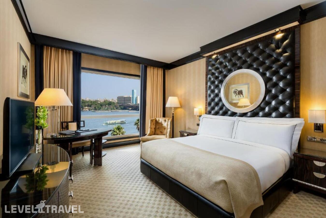 фотографии номера Двухместный номер Partial Nile View Deluxe Premier двуспальная кровать отеля Fairmont Nile City в Египет(Каир) - фото №1