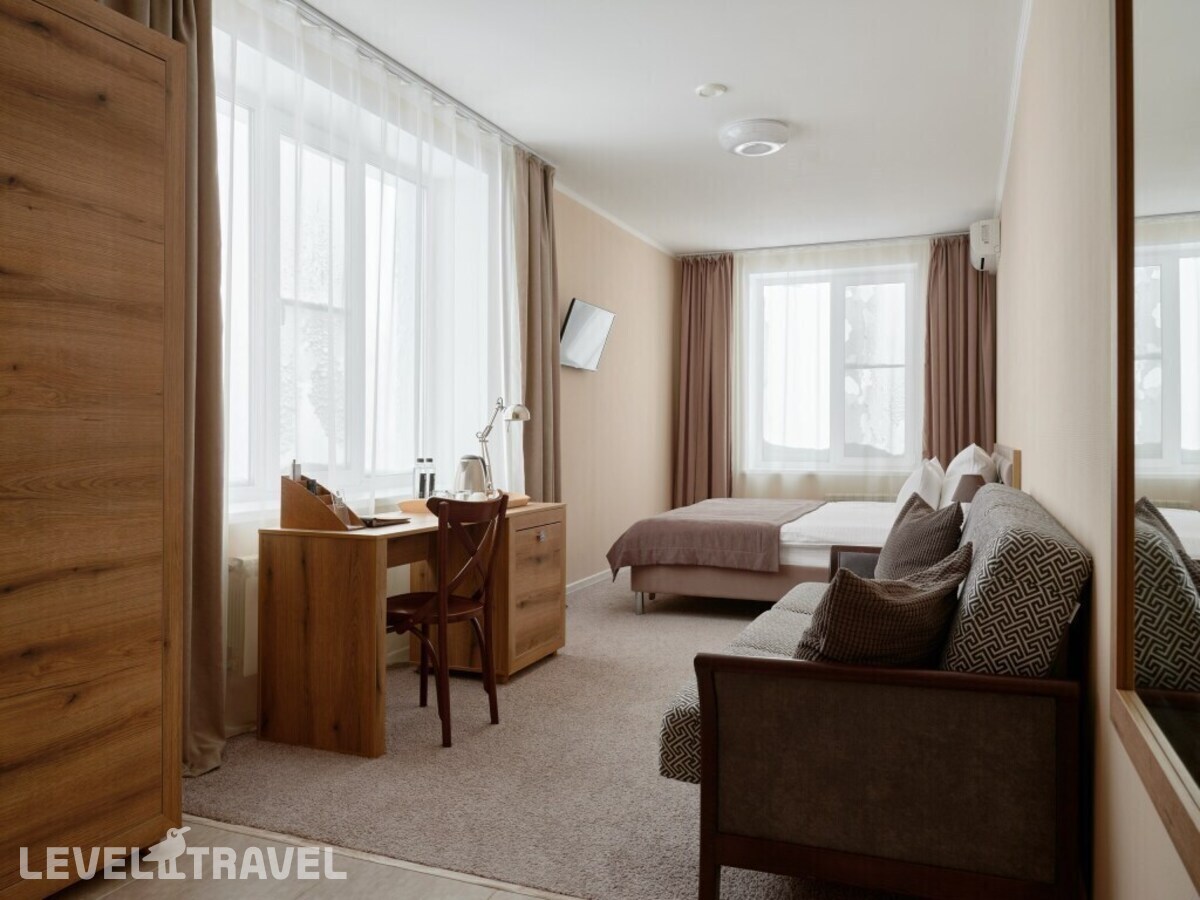 фотографии номера Трёхместный номер Comfort с видом на город отеля Отель Сибирский Сафари Клуб в Россия(Красноярск) - фото №12