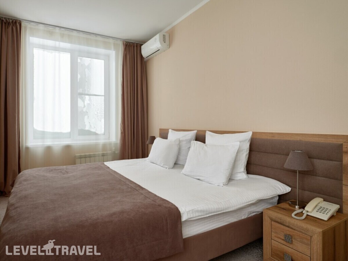 фотографии номера Трёхместный номер Comfort с видом на город отеля Отель Сибирский Сафари Клуб в Россия(Красноярск) - фото №13