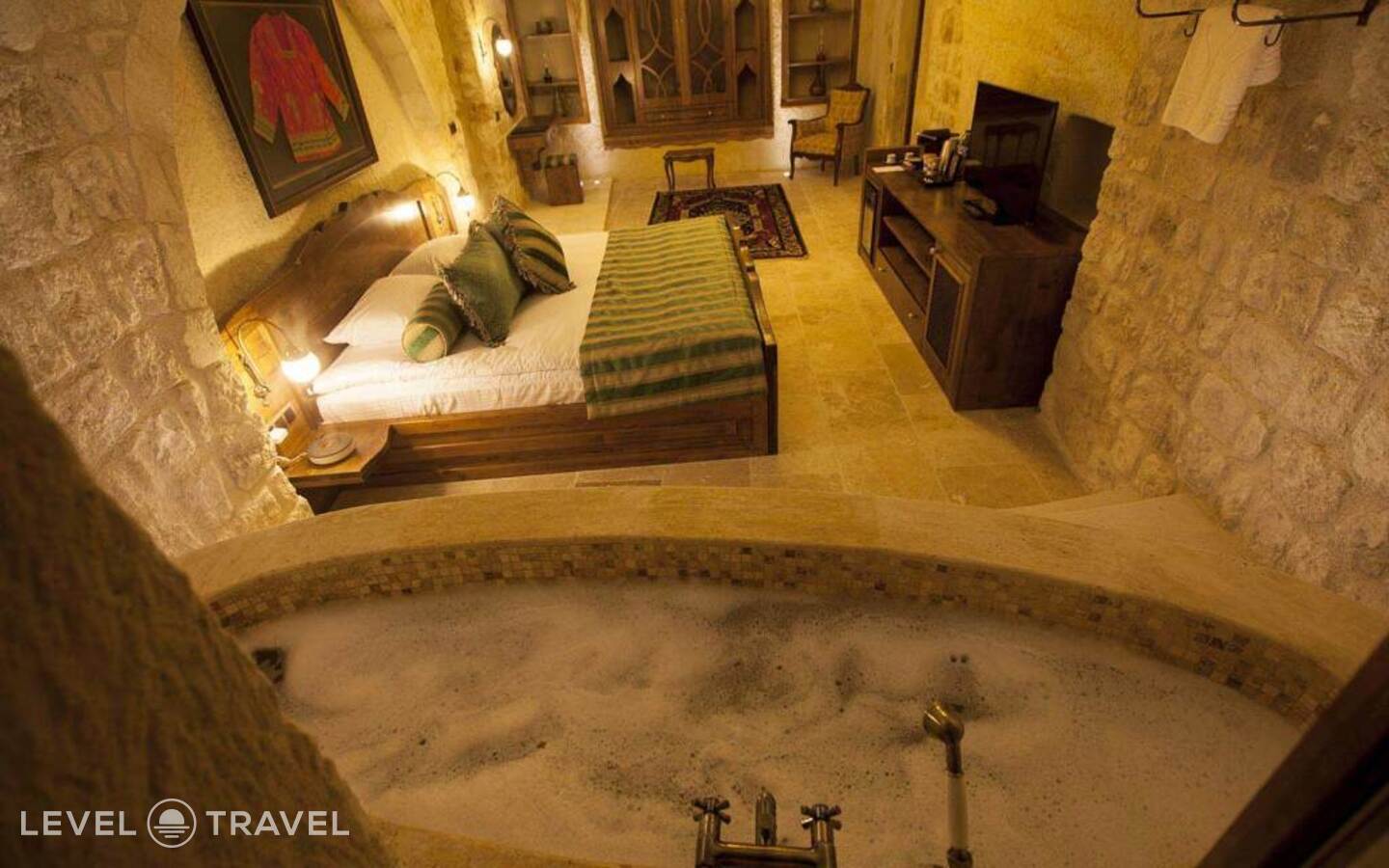 фотографии номера Двухместный люкс Glorious Cave двуспальная кровать отеля Kayakapi Premium Caves Cappadocia Hotel в Турция(Ургюп) - фото №5