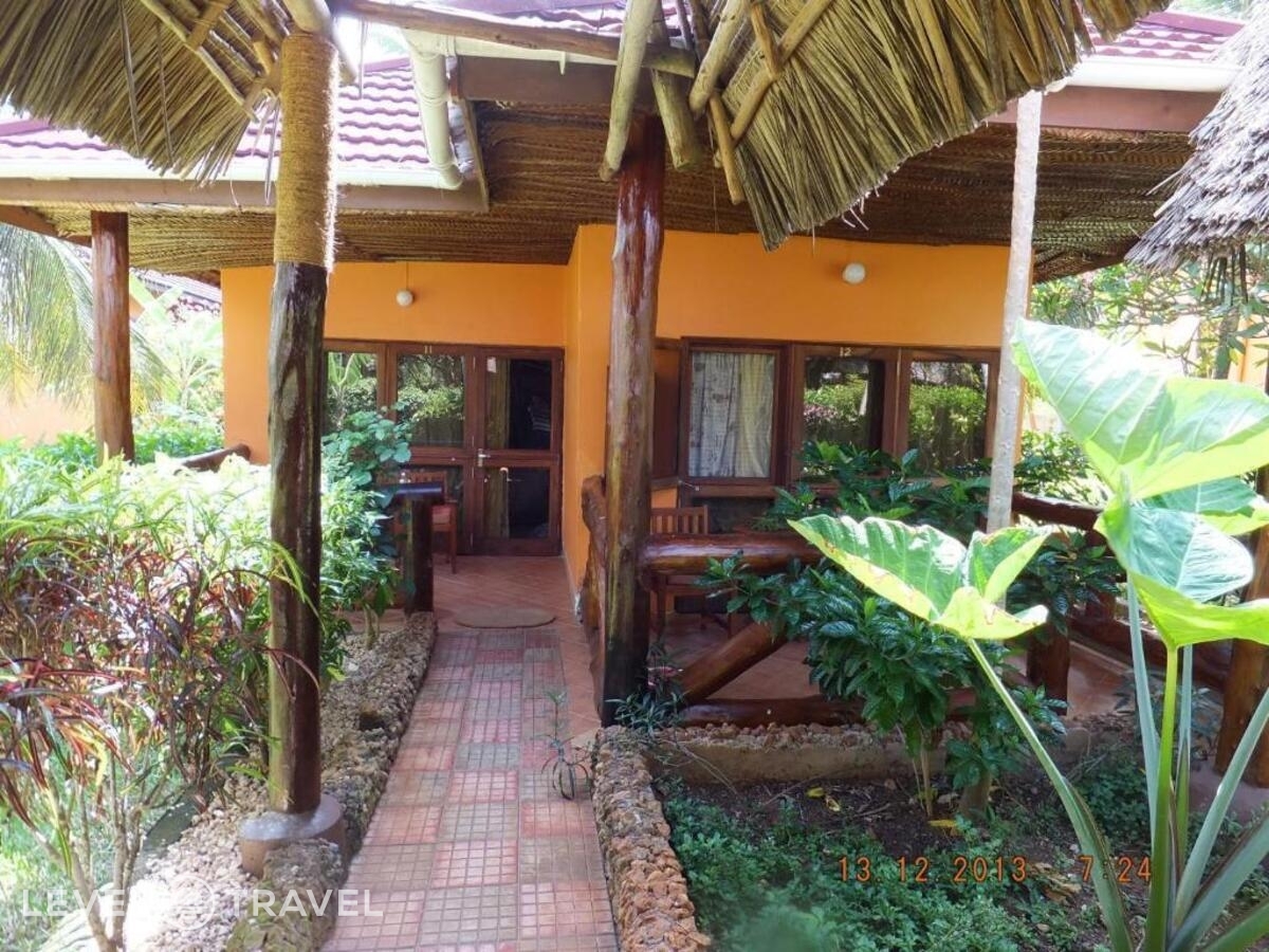 фотографии номера Стандартный с видом на сад отеля Mnarani Beach Cottage в Танзания(Нунгви Бич) - фото №5