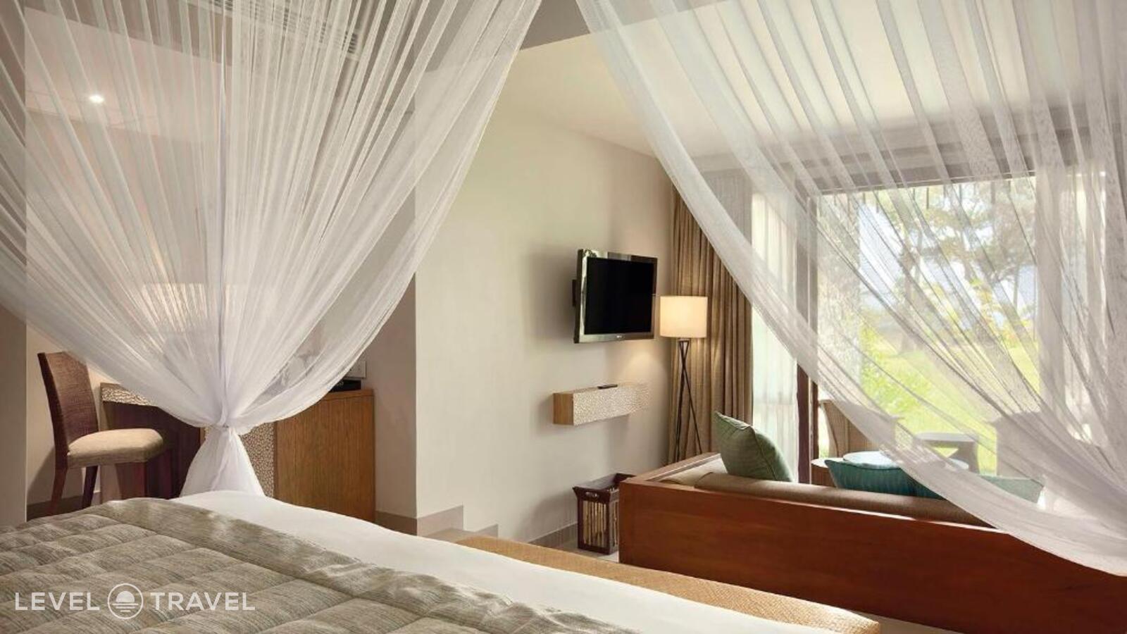 фотографии номера Делюкс Laguna отеля Kempinski Seychelles Resort в Сейшелы(о. Маэ) - фото №1