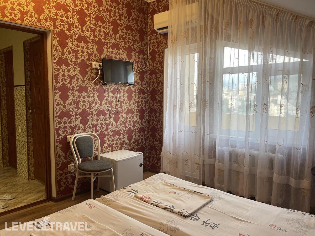 Комната стандарт c 2 односпальными кроватями с балконом — фото 2
