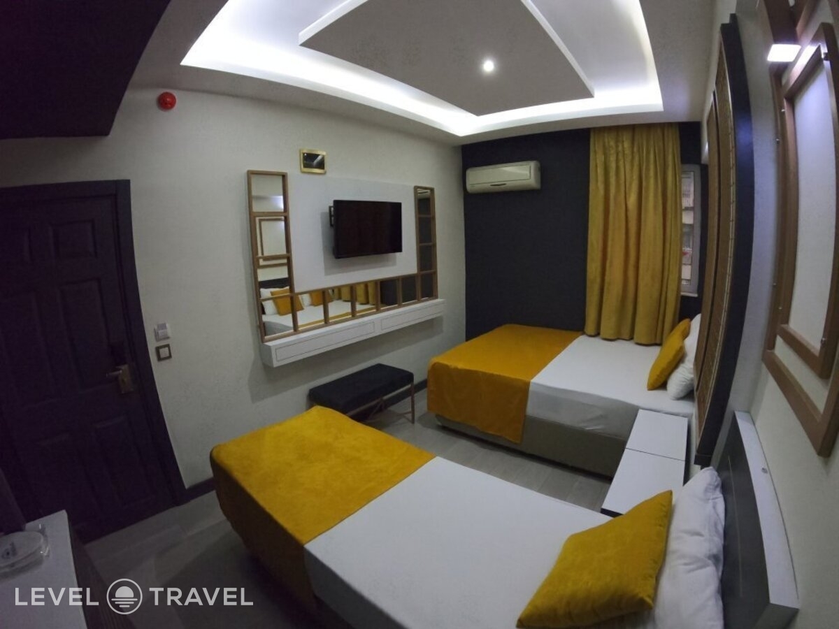 фотографии номера Трехместный номер отеля Exporoyal Hotel в Турция(Анталья - Центр) - фото №13