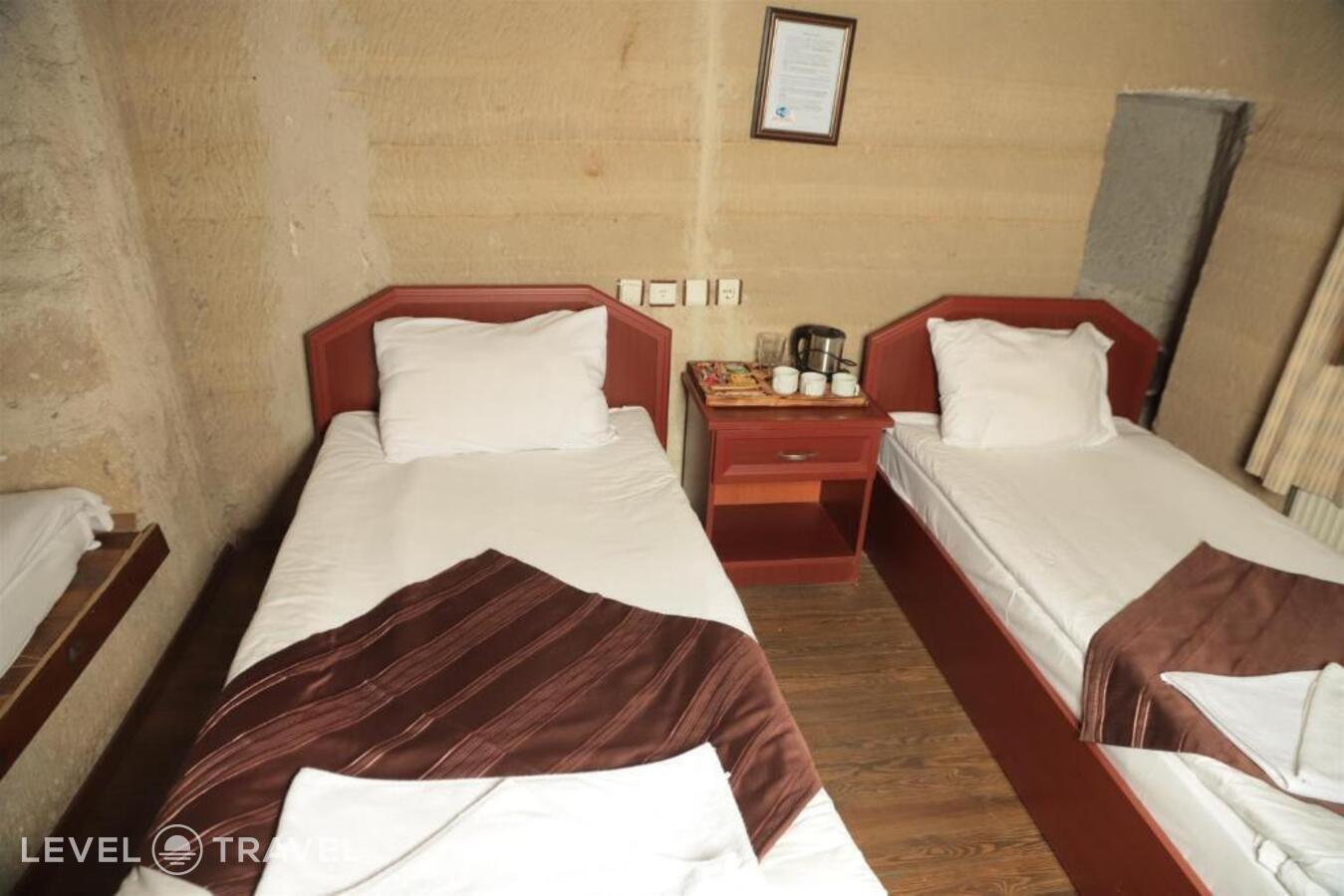 фотографии номера Четырехместный номер отеля Guven Cave Hotel в Турция(Гёреме) - фото №6
