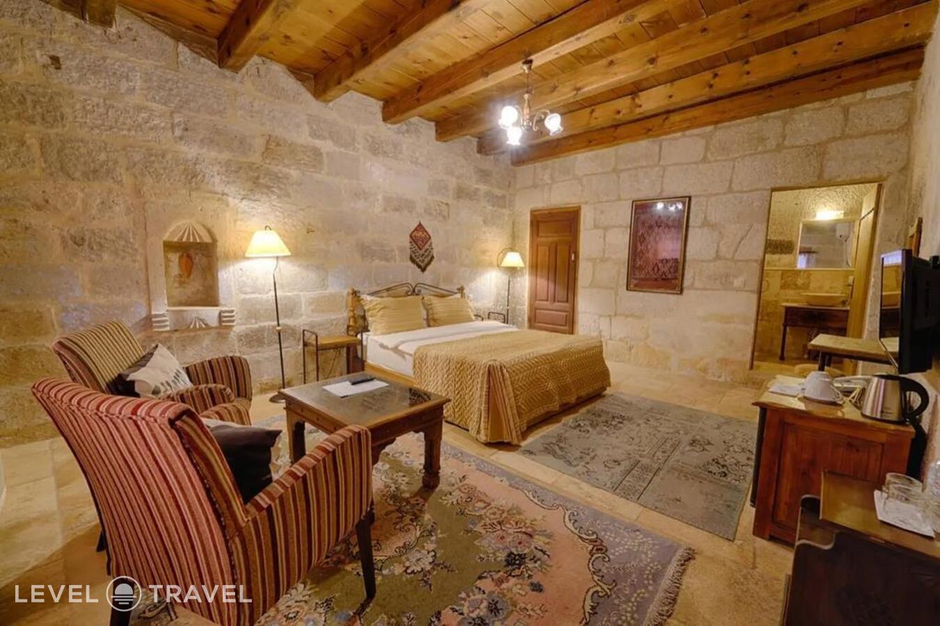 фотографии номера Двухместный полулюкс Cave двуспальная кровать отеля Tekkaya Cave Hotel в Турция(Гёреме) - фото №2