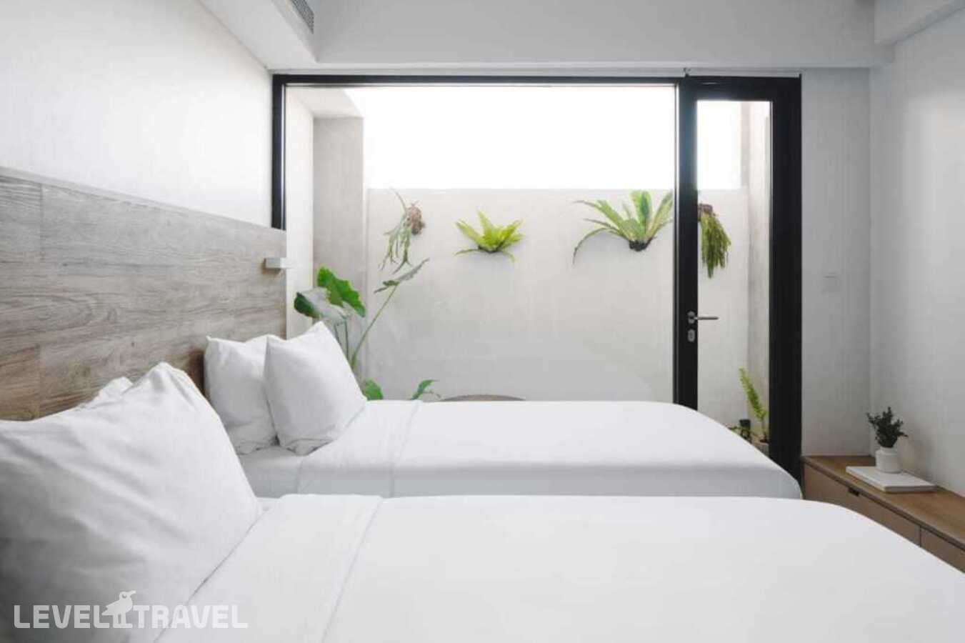 фотографии номера Двухместный номер The Standard 2 отдельные кровати отеля Lloyd's Inn Bali - Chse Certified в Индонезия(Семиньяк) - фото №1