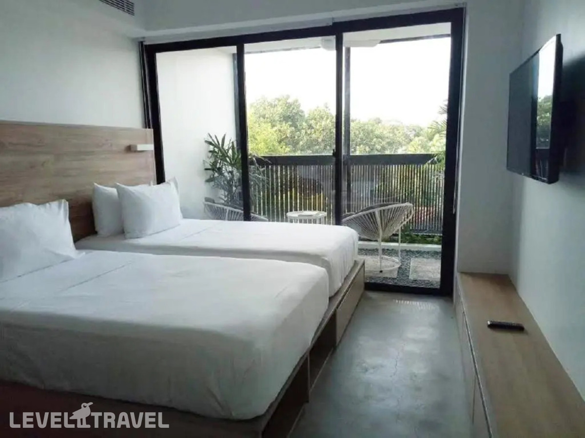 фотографии номера Двухместный номер The Garden 2 отдельные кровати отеля Lloyd's Inn Bali - Chse Certified в Индонезия(Семиньяк) - фото №1