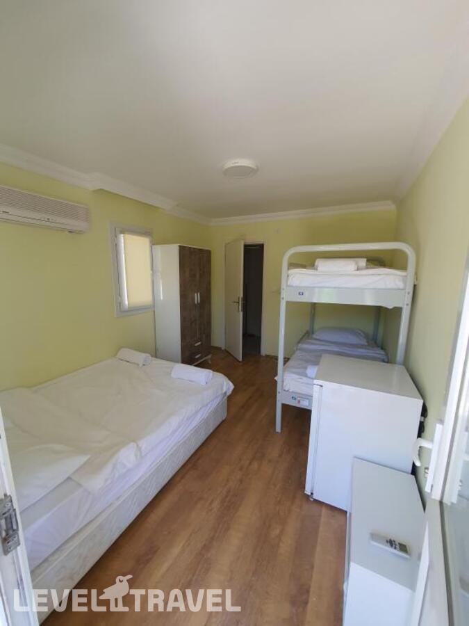 фотографии номера Четырёхместный номер Standard с красивым видом из окна отеля Orange Beach Camp в Турция(Гёйнюк) - фото №1