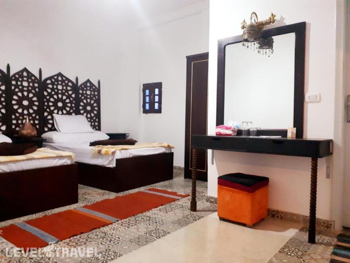 фотографии номера Стандартный номер отеля Arabian Nights Pyramids Guesthouse в Египет(Гиза) - фото №1