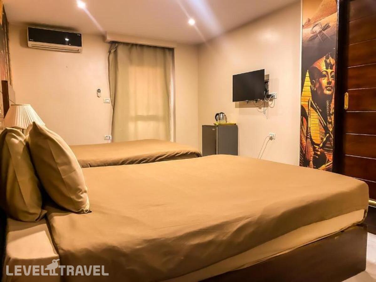 фотографии номера Делюкс (две односпальные кровати) отеля Giza Pyramids Inn в Египет(Гиза) - фото №9