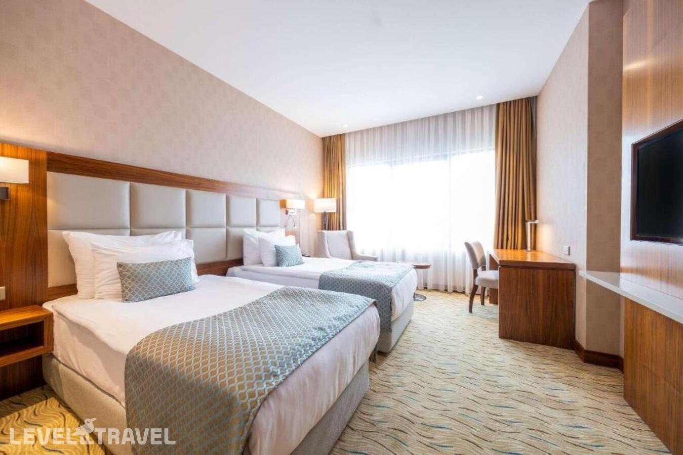 фотографии номера Номер бизнес (две односпальные кровати) отеля Clarion Hotel Istanbul Mahmutbey в Турция(Багджылар) - фото №2