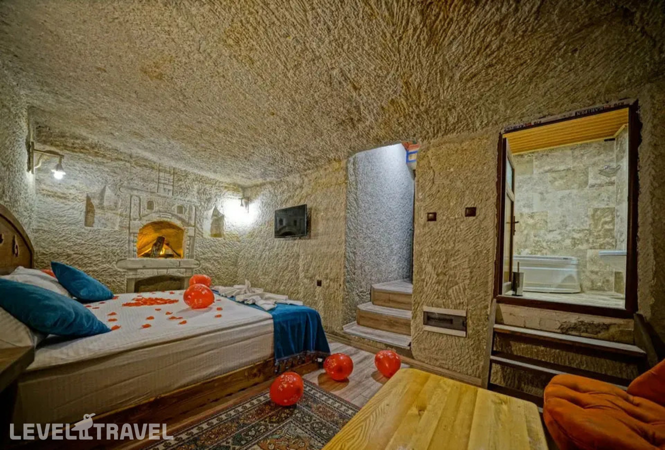 фотографии номера Двухместный номер Cave Jacuzzi двуспальная кровать отеля Cappa Cave Hotel в Турция(Гёреме) - фото №4