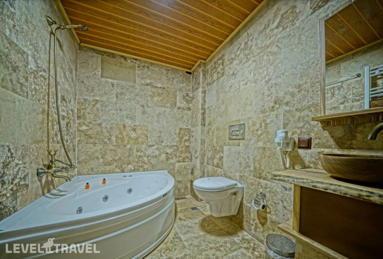фотографии номера Двухместный номер Cave Jacuzzi двуспальная кровать отеля Cappa Cave Hotel в Турция(Гёреме) - фото №8