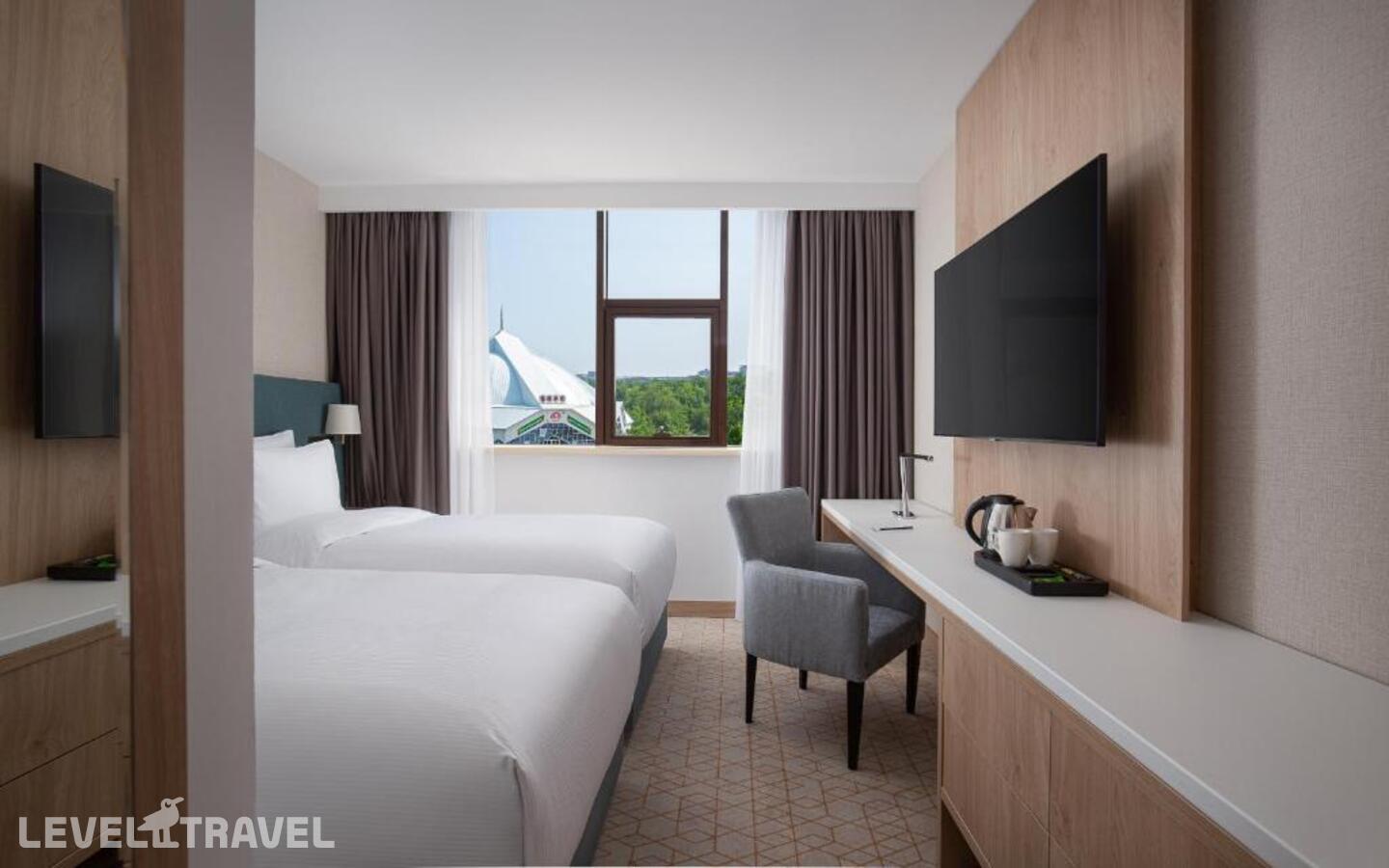 фотографии номера Стандартный (две односпальные кровати) отеля Doubletree By Hilton Shymkent в Казахстан(Шымкент) - фото №3