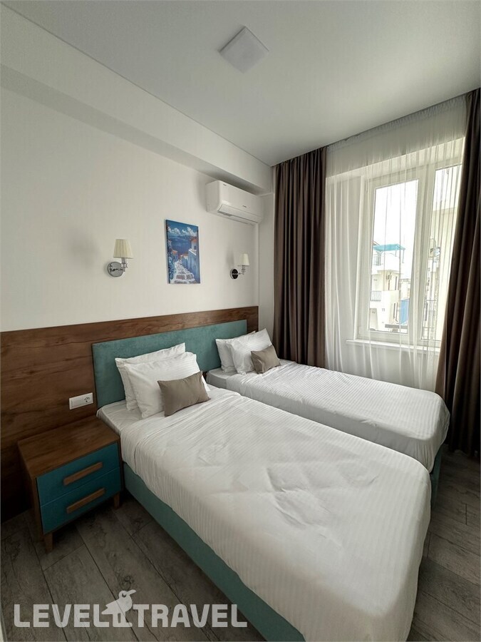 фотографии номера Двухуровневый люкс с видом на море отеля Santorini Family Club Hotel в Россия(Каспийск) - фото №5