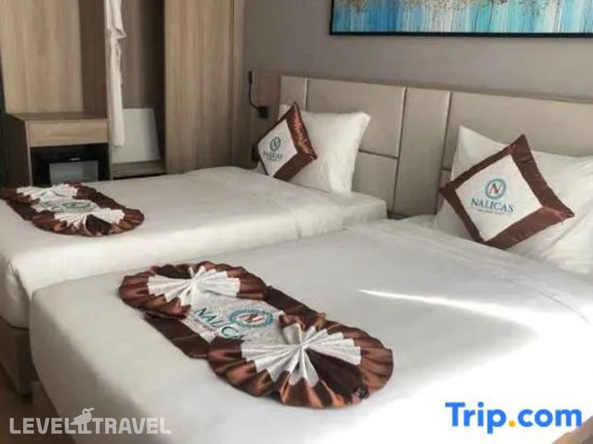 фотографии номера Номер Deluxe с балконом и с частичным видом на море отеля Nalicas Hotel в Вьетнам(Нячанг) - фото №5