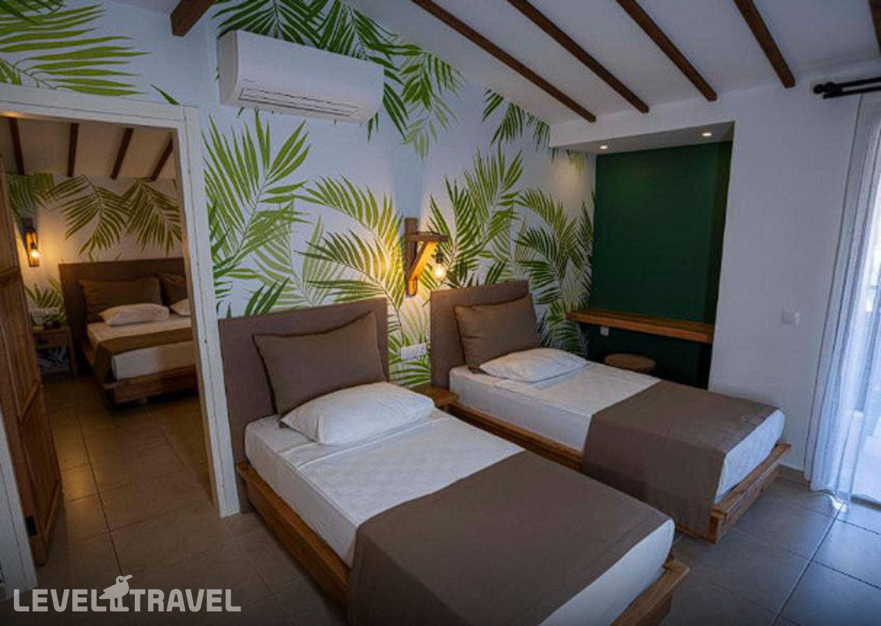 фотографии номера Семейный делюкс с видом на сад отеля Tuana Club Fethiye (Ex. Majesty Club Tuana) в Турция(Яныклар) - фото №1