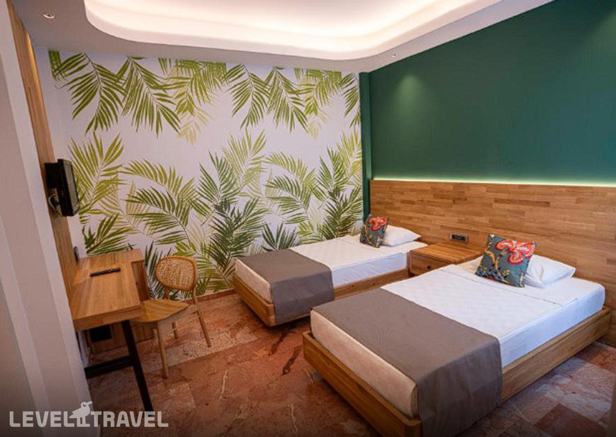фотографии номера Семейный делюкс с видом на сад отеля Tuana Club Fethiye (Ex. Majesty Club Tuana) в Турция(Яныклар) - фото №3