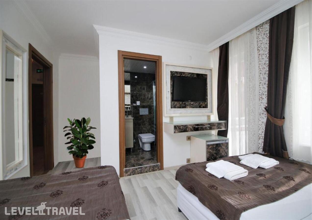фотографии номера Стандартный номер отеля Behram Hotel в Турция(Коньяалты) - фото №1
