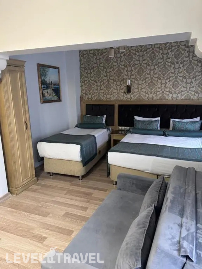 фотографии номера Трёхместный номер Семейный отеля Blue Tuana Suite в Турция(Фатих) - фото №1