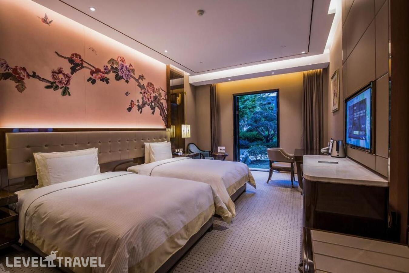 фотографии номера Делюкс (две односпальные кровати) отеля Shanghai Royal Garden Hotel в Китай(Шанхай) - фото №1