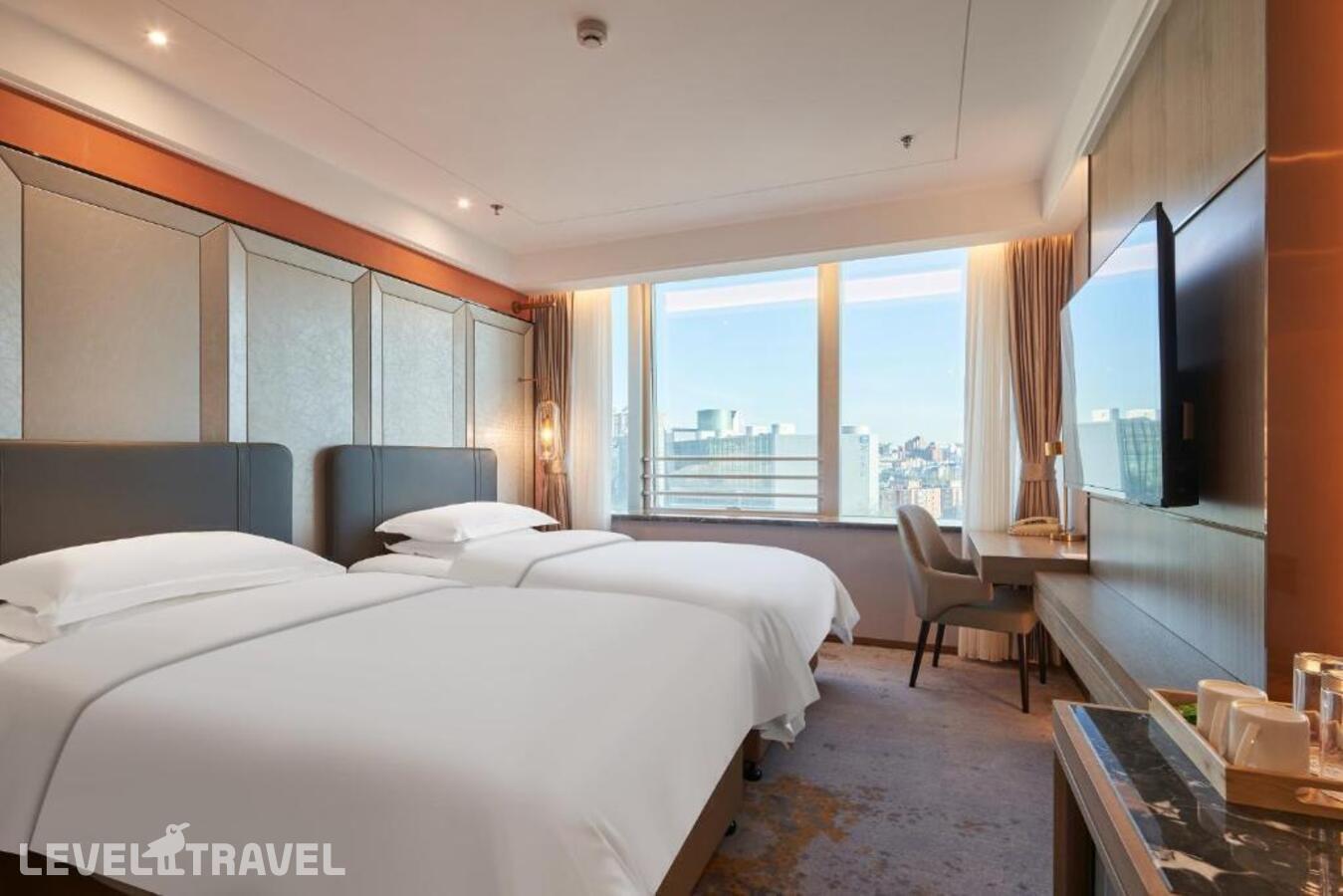 фотографии номера Улучшенный (две односпальные кровати) отеля Howard Johnson Paragon Hotel в Китай(Пекин) - фото №1
