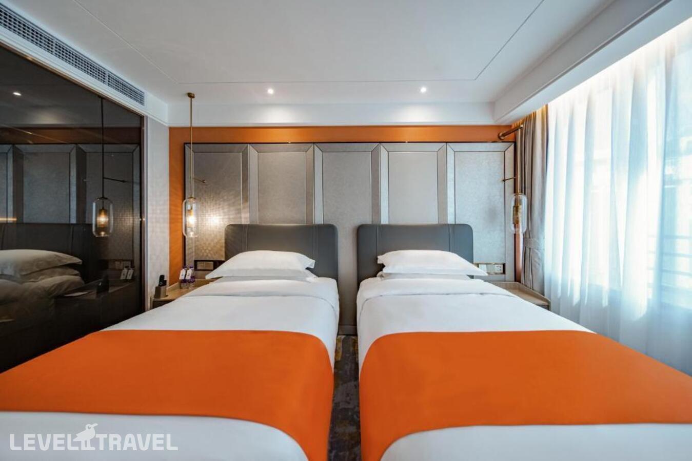 фотографии номера Улучшенный (две односпальные кровати) отеля Howard Johnson Paragon Hotel в Китай(Пекин) - фото №4