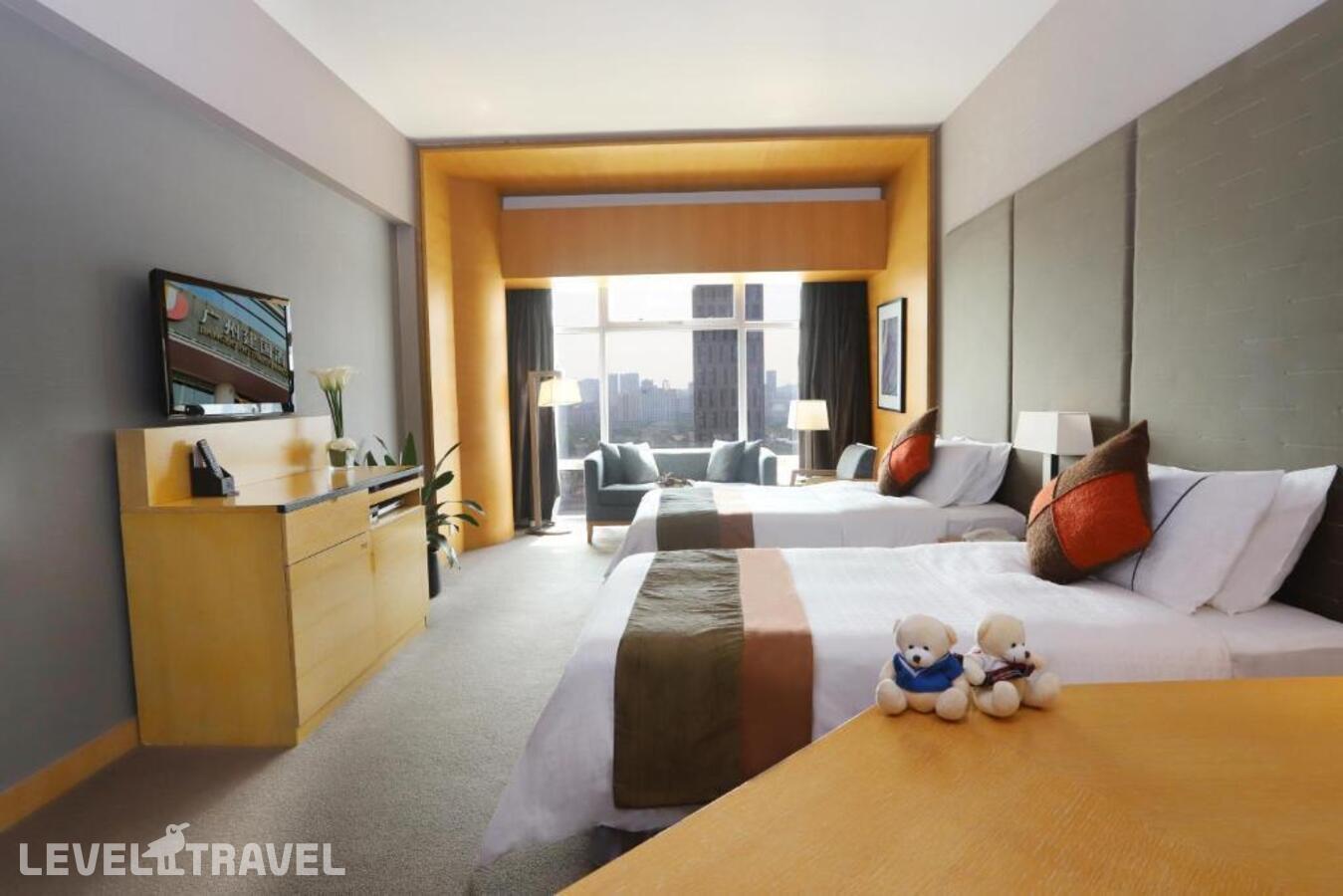 фотографии номера Делюкс (две односпальные кровати) отеля Jianguo Hotel Guangzhou в Китай(Гуанчжоу) - фото №3