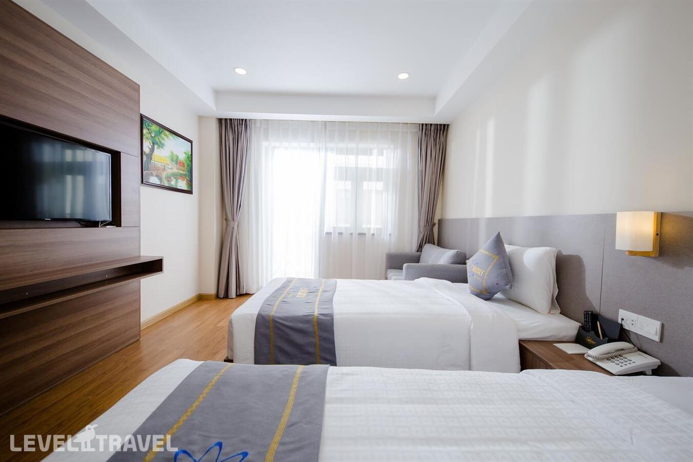 фотографии номера Делюкс с видом на море (две односпальные кровати) отеля Orbit Hotel Resort & Spa в Вьетнам(Нячанг) - фото №1
