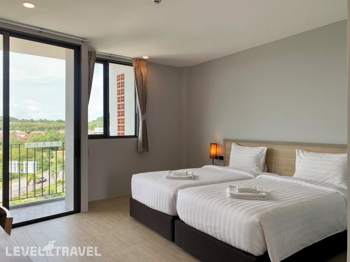 фотографии номера Улучшенный (две односпальные кровати) отеля Atom Phuket Hotel в Таиланд(Най Янг Бич) - фото №2