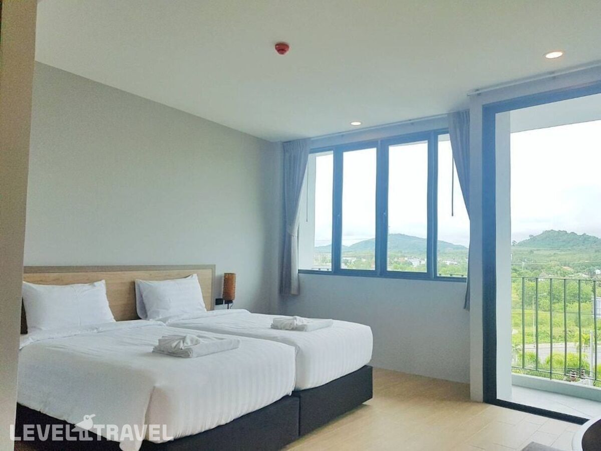 фотографии номера Улучшенный (две односпальные кровати) отеля Atom Phuket Hotel в Таиланд(Най Янг Бич) - фото №3
