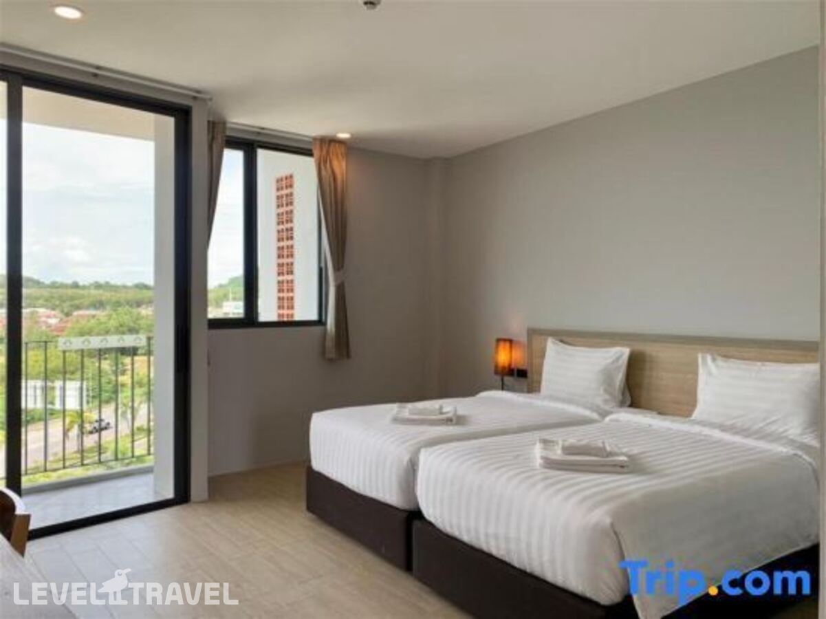 фотографии номера Делюкс (две односпальные кровати) отеля Atom Phuket Hotel в Таиланд(Най Янг Бич) - фото №18