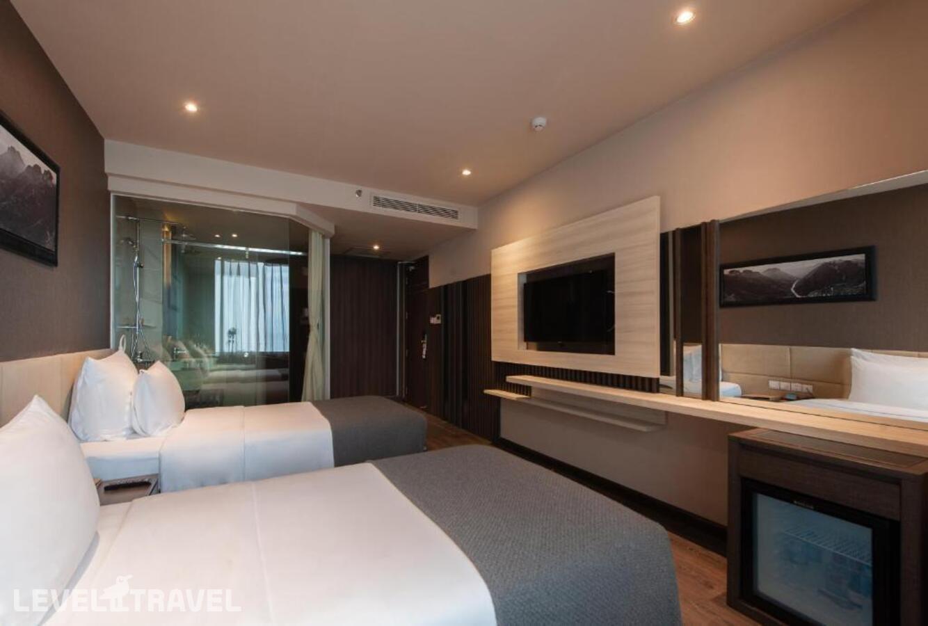 фотографии номера Делюкс (две односпальные кровати) отеля Alana Beach Hotel Nha Trang в Вьетнам(Нячанг) - фото №3