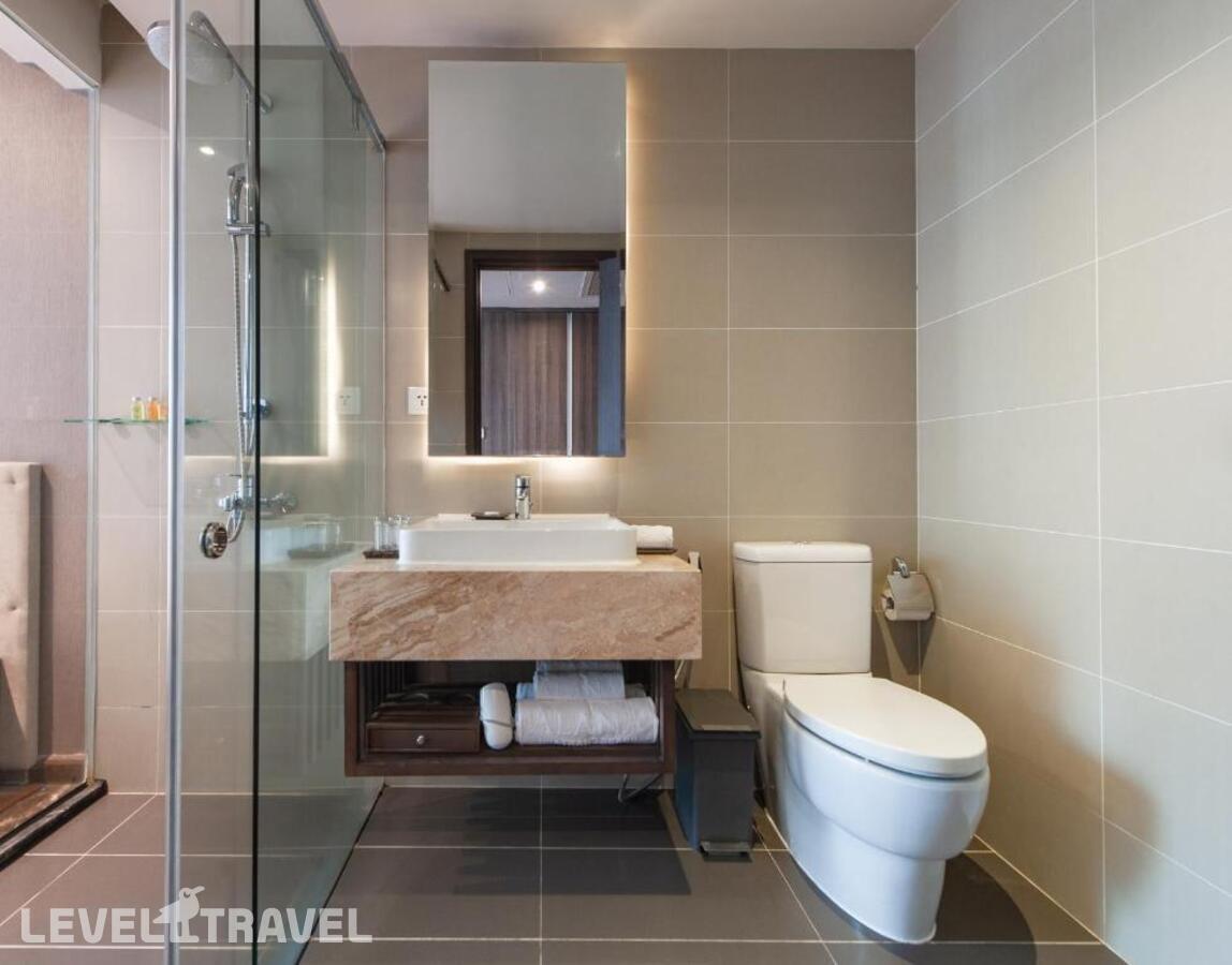 фотографии номера Делюкс (две односпальные кровати) отеля Alana Beach Hotel Nha Trang в Вьетнам(Нячанг) - фото №2